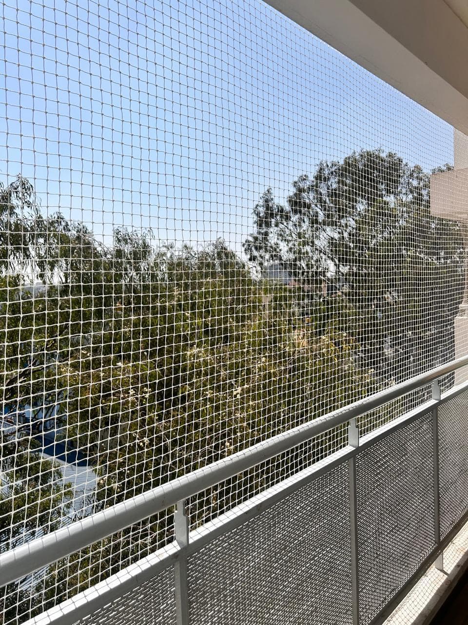 Balcony safety net installation in a Kakinada home